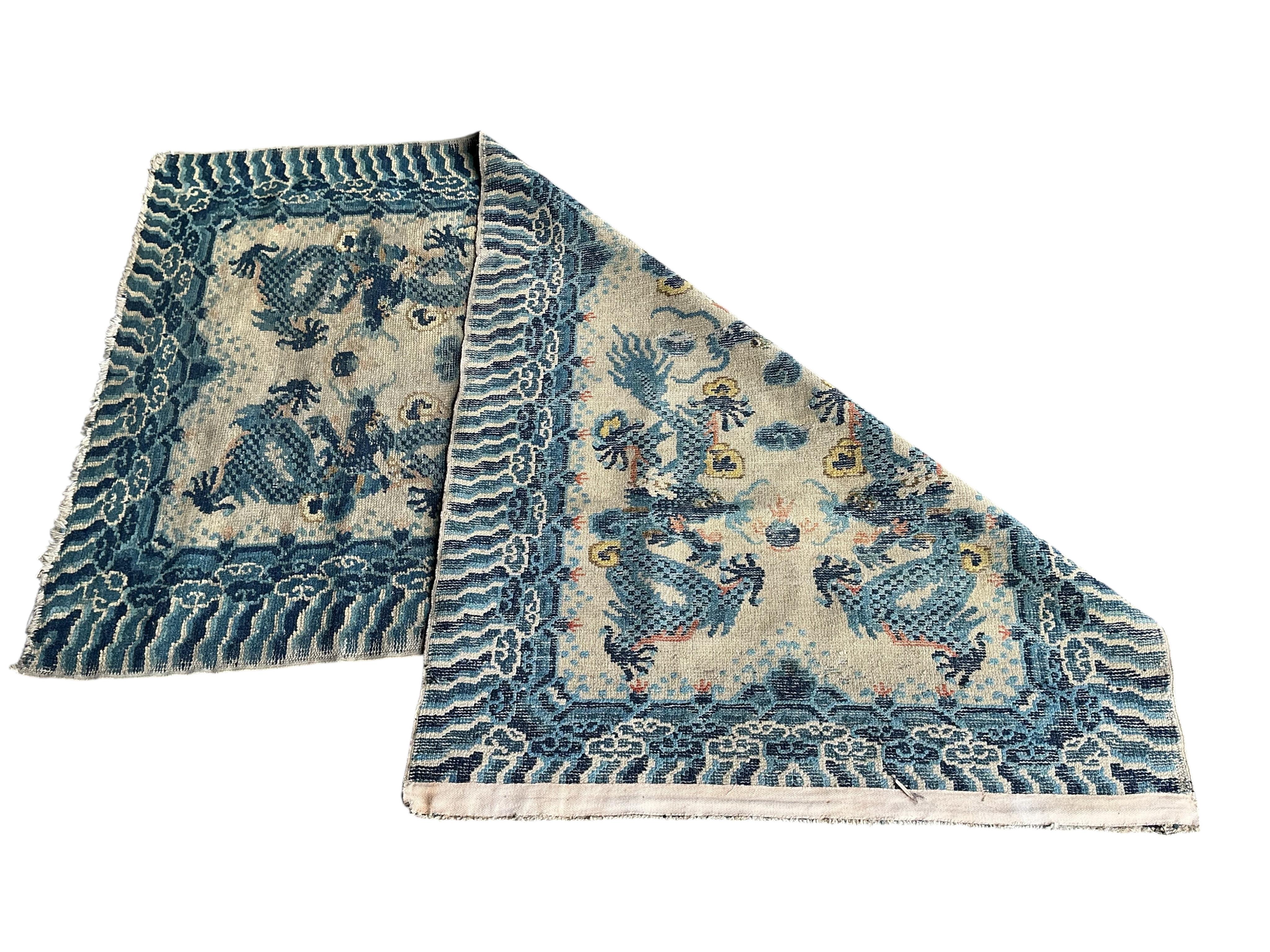 A Chinese ivory ground dragon palace rug, Qing Dynasty, 148 x 79cm